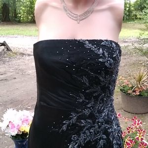 "Jouani" black slim dress w/embelishments on side